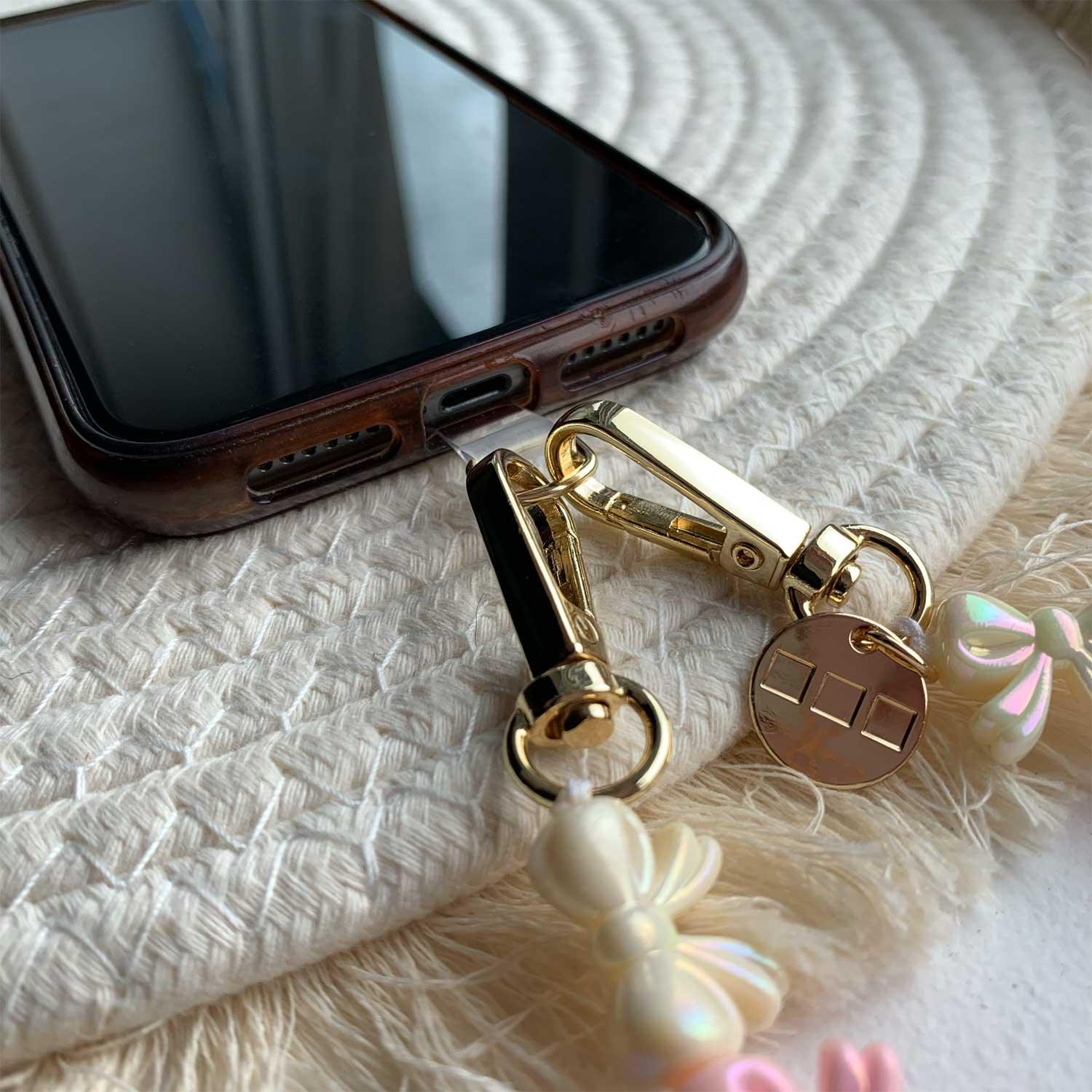 Cordon de téléphone Bow - rose clair blanc - or